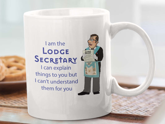 image of the "I am the Lodge Secretary" Masonic mug with an illustration by Gerald Sclater and the phrase "I can explain things to you but I can’t understand them for you". The bold and stylish design of the mug is visible, with the words lodge secretary prominently displayed in A MASONIC FONT.