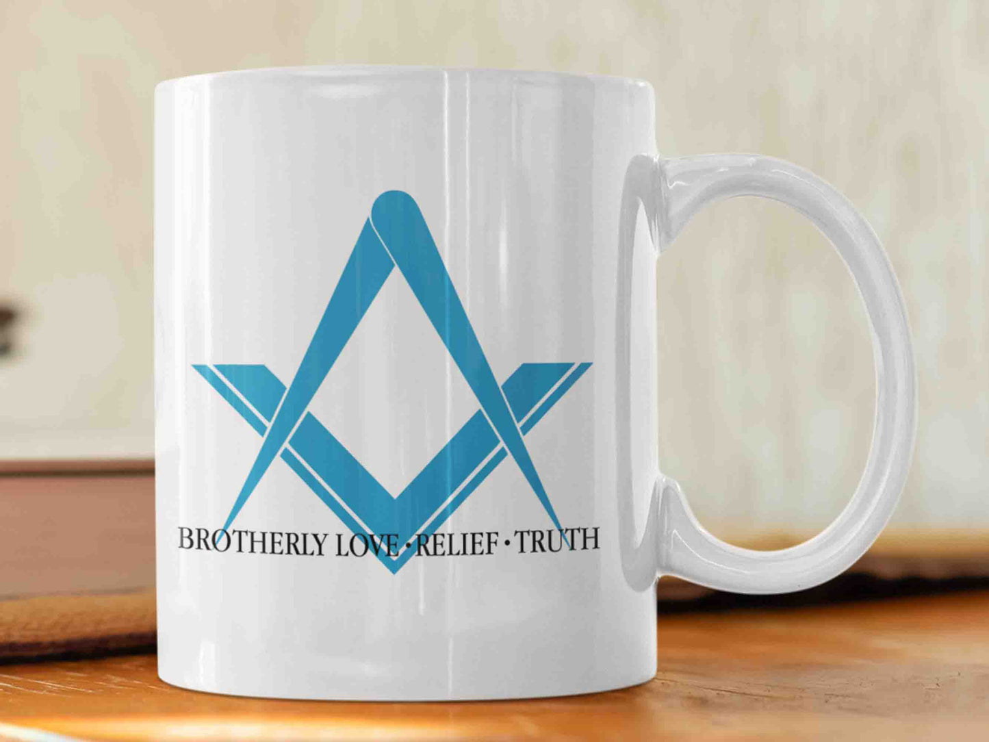 Show your support for the Freemason brotherhood with this high-quality "Brotherly Love, Relief and Truth" Masonic mug. This 11 oz ceramic mug features a striking design, with the iconic blue square and compass symbol, and the text "Brotherly Love, Relief and Truth" written in black in a traditional Masonic font style. A great gift for any Masonic enthusiast.