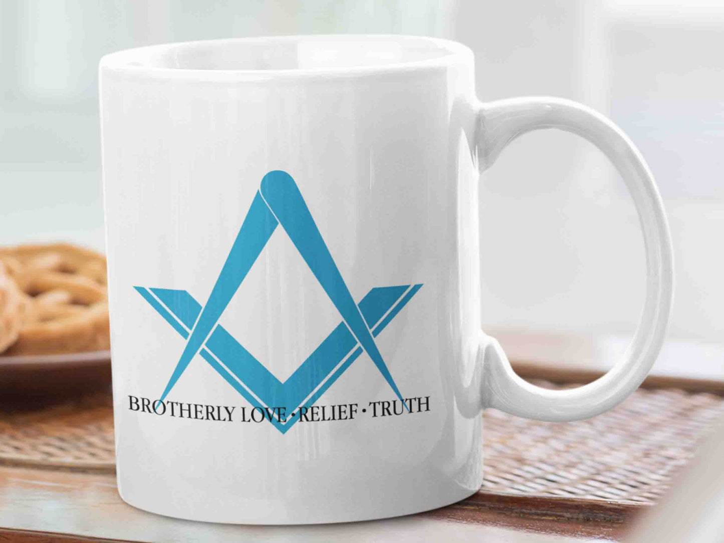 Start your day off on the right foot with the "Brotherly Love, Relief and Truth" Masonic mug. This ceramic mug features the iconic blue square and compass symbol, and the text "Brotherly Love, Relief and Truth" written in black in a traditional Masonic font style. Perfect for sipping your morning coffee or tea while contemplating the principles of the Freemason brotherhood.