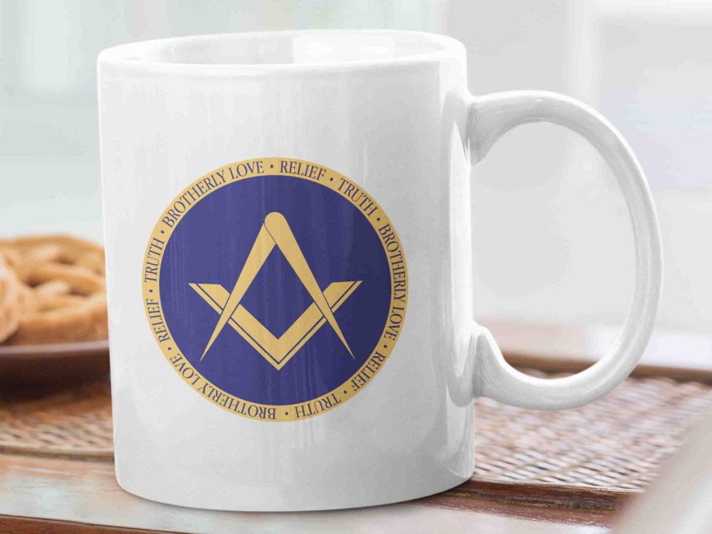 Start your day off in style with the "Brotherly Love, Relief and Truth" Masonic mug. This 11oz ceramic mug features a elegant design, with a golden bronze square and compass symbol in a deep dark Masonic blue circle and the text "Brotherly Love, Relief and Truth" repeated in the golden bronze outer circle. Perfect for sipping your morning coffee or tea while reflecting on the principles of the Freemason brotherhood.