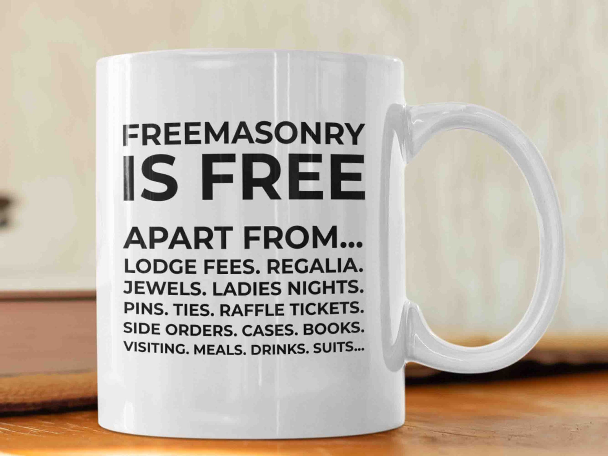 "Freemasonry is free apart from" Masonic mug and elevate your morning routine with a message that speaks to the inside jokes of the Freemason brotherhood. This high-quality 11oz ceramic mug features a design with the phrase "Freemasonry is free apart from" followed by a list of items in reducing size and never ending. A great gift for any Masonic enthusiast or for yourself, this mug is perfect for sipping your morning coffee or tea while reflecting on the principles and values of the Freemason brotherhood.