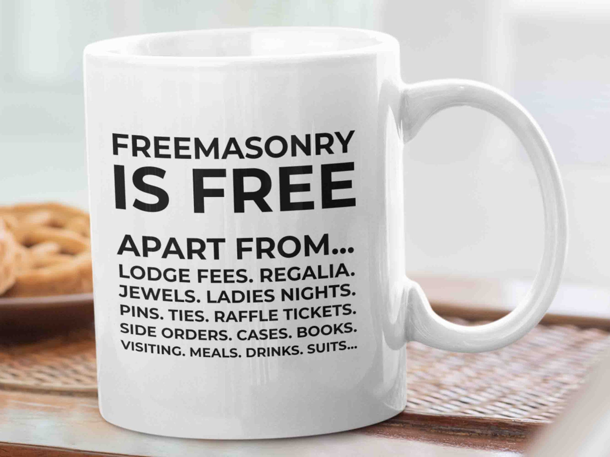 Start your day with a laugh and a reminder of the inside jokes of the Freemason brotherhood with the "Freemasonry is free apart from" Masonic mug. This 11oz ceramic mug features a design with the phrase "Freemasonry is free apart from" followed by a list of items in reducing size and never ending, highlighting the often made joke among Freemasons about the costs associated with being a member of the organization.