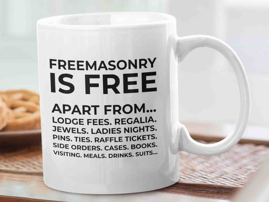 Start your day with a laugh and a reminder of the inside jokes of the Freemason brotherhood with the "Freemasonry is free apart from" Masonic mug. This 11oz ceramic mug features a design with the phrase "Freemasonry is free apart from" followed by a list of items in reducing size and never ending, highlighting the often made joke among Freemasons about the costs associated with being a member of the organization.